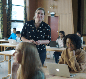 A teacher advising a student in exam conditions